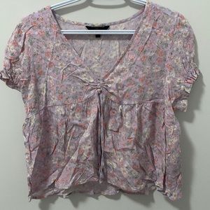 purple shirt with flowers